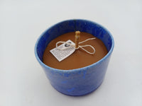 Top angled view of beeswax and blue ceramic