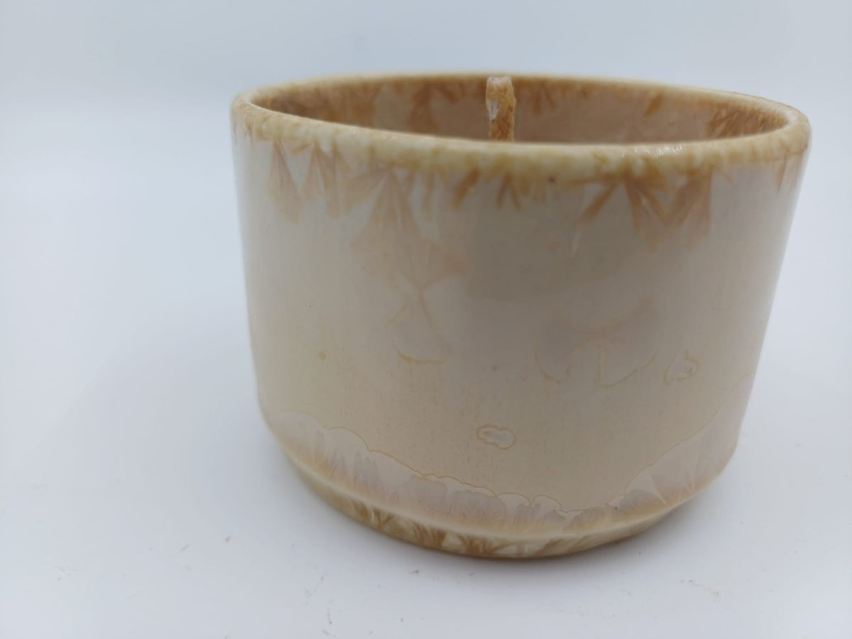 Ivory crystalline ceramic vessel beeswax candle front view