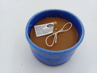Ceramic candle with natural beeswax viewed from above