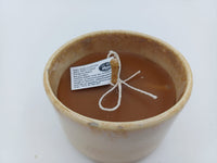 Top angle of ivory glazed ceramic vessel candle with beeswax