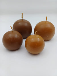 Round 100% beeswax candles in small and large sizes, hand cast in Latvia