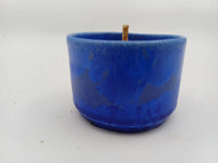 Cobalt vessel showing blue glaze and wax wick
