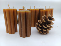 Petal pillar candles with decorative pinecone