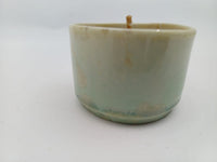 Seafoam green handmade ceramic candle side view
