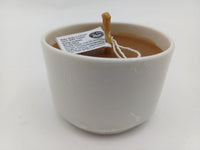 White ceramic beeswax candle with maker's label