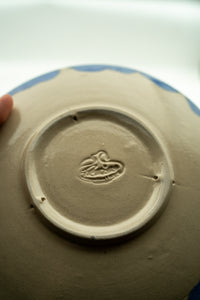 Hand-finished base and maker's mark on the Midnight Cobalt bowl