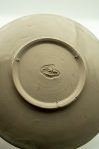 Hand-finished base and maker's mark on the Amber Bloom plate