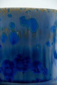 Close detail of cobalt crystalline blooms on the mug