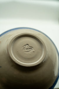 Hand-finished base and maker's mark on the Cobalt Halo bowl