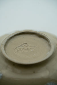 Hand-finished base and maker's mark on the small dish